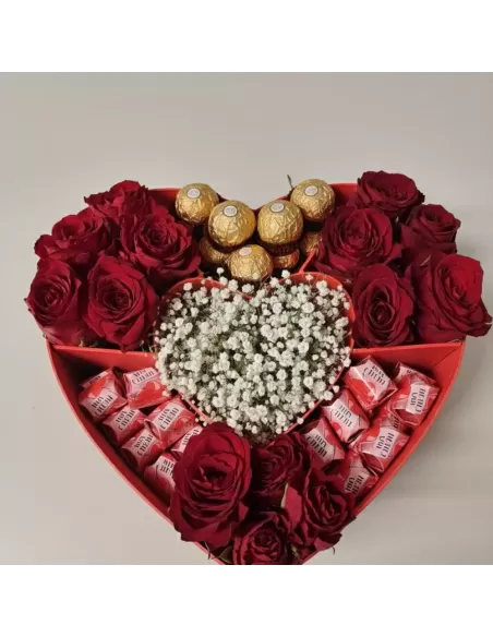 Heart box with red roses and pralines