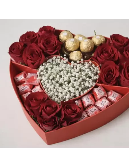 Heart box with red roses and pralines