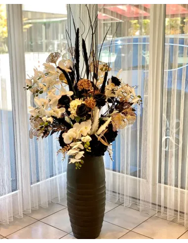 Large floral arrangement in black, white and gold, available for rent