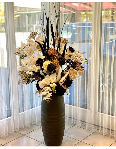 Large floral arrangement in black, white and gold, available for rent